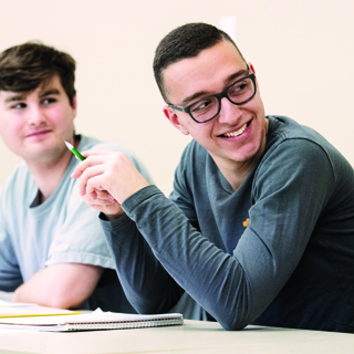 Two male students in class Two male students in class