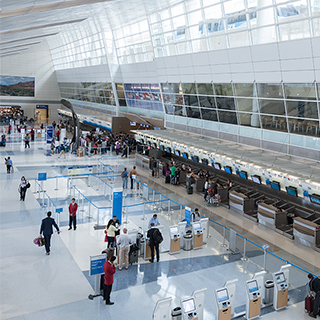 One of six terminals at DFW International Airport. Photo: DFW International Airport The ticketing counters inside a Dallas-Fort Worth International Airport terminal that features four-story-tall ceilings with abundant natural light