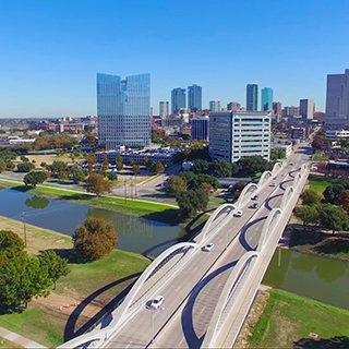 A view of the Seventh Street bridge leading into downtown Fort Worth, Texas, against a cloudless blue sky A view of the Seventh Street bridge leading into downtown Fort Worth, Texas, against a cloudless blue sky