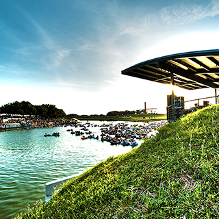 Floating down the Trinity River near downtown Fort Worth Photo: Visit Fort Worth A cluster of people in inflated black inner tubes floats down the Trinity River with a portion of the Fort Worth skyline in the background