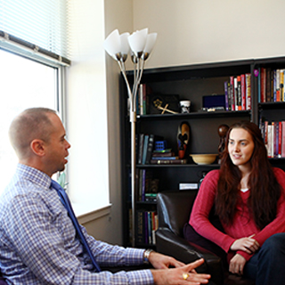Rev. Todd Boling of TCU Religious and Spiritual Life talks to a student in his office. Rev. Todd Boling of TCU Religious and Spiritual Life talks to a student in his office.